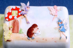 Cake decorated with fairies and toadstool